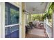Inviting front porch with comfortable seating, ferns, and a ceiling fan at 2306 Club Rd, Charlotte, NC 28205