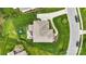 Aerial view of a backyard with green grass, a patio area, a play area, and a fenced perimeter at 2655 Stonewood Vw, Kannapolis, NC 28081