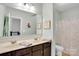 Double vanity bathroom with modern fixtures and a shower tub at 2655 Stonewood Vw, Kannapolis, NC 28081