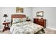 Comfortable bedroom with a wicker headboard, dresser, and soft lighting at 2655 Stonewood Vw, Kannapolis, NC 28081