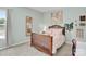 Cozy bedroom with a wood frame bed, soft carpet, and painted walls at 2655 Stonewood Vw, Kannapolis, NC 28081