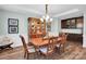 Formal dining room showcases hardwood floors and decorative chair rail accents at 2655 Stonewood Vw, Kannapolis, NC 28081