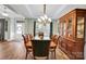 Formal dining room featuring a chandelier, wood floors, and a classic china cabinet at 2655 Stonewood Vw, Kannapolis, NC 28081
