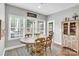 Bright dining area with lots of natural light, a dining table and a china cabinet at 2655 Stonewood Vw, Kannapolis, NC 28081