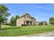 A two-story home with a manicured lawn, featuring brick accents and a well-maintained green lawn at 2655 Stonewood Vw, Kannapolis, NC 28081