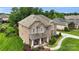 Charming two-story brick home with a welcoming front porch, lovely landscaping, and a well-maintained lawn at 2655 Stonewood Vw, Kannapolis, NC 28081