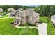 Beautiful brick home with manicured lawn and landscaping, featuring a long driveway and mature trees at 2655 Stonewood Vw, Kannapolis, NC 28081
