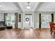 Inviting foyer with hardwood floors, elegant lighting, and a front door adorned with a wreath at 2655 Stonewood Vw, Kannapolis, NC 28081