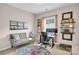 Bright home office with natural light, a comfortable couch, and an ergonomic desk setup, perfect for remote work at 2655 Stonewood Vw, Kannapolis, NC 28081