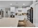 Modern kitchen boasts white cabinetry, stainless steel appliances, and an island with seating at 2655 Stonewood Vw, Kannapolis, NC 28081