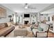 Inviting living area with fireplace, large TV, comfortable seating and access to kitchen and dining areas at 2655 Stonewood Vw, Kannapolis, NC 28081
