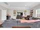 Bright living room featuring modern furnishings, neutral tones, recessed lighting, and entertainment center at 2655 Stonewood Vw, Kannapolis, NC 28081