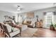 Comfortable living room features hardwood floors, a ceiling fan, and stylish decor at 2655 Stonewood Vw, Kannapolis, NC 28081