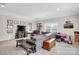 Spacious living room with a comfortable seating area, entertainment center, and cozy workspace, perfect for relaxing and entertaining at 2655 Stonewood Vw, Kannapolis, NC 28081
