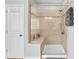 Modern shower with sleek glass doors, tiled walls, and a built-in bench, providing a luxurious bathing experience at 2655 Stonewood Vw, Kannapolis, NC 28081