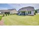 Expansive backyard featuring a covered patio, well-kept lawn, and mature landscaping at 3029 Trace Meadow Ct, York, SC 29745