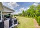 Large backyard with a patio, seating, and a well-maintained lawn at 3029 Trace Meadow Ct, York, SC 29745