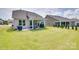 Spacious backyard with a covered patio, seating area, and lush green lawn at 3029 Trace Meadow Ct, York, SC 29745