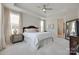 Bright bedroom with a trey ceiling, large windows, and a king-sized bed with ensuite bathroom at 3029 Trace Meadow Ct, York, SC 29745