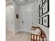 Bright foyer with light wood floors, a bench, and decorative wall art at 3029 Trace Meadow Ct, York, SC 29745