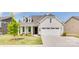 Charming single-Gathering home with a two-car garage, manicured lawn, and inviting front porch at 3029 Trace Meadow Ct, York, SC 29745