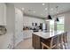 Bright kitchen featuring a large island with sink, stainless steel appliances, and white cabinets at 3029 Trace Meadow Ct, York, SC 29745