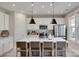 Modern kitchen features a spacious island with seating, stainless steel appliances, and stylish pendant lighting at 3029 Trace Meadow Ct, York, SC 29745