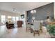 Open-concept living area with modern light fixtures, a fireplace, and comfortable seating at 3029 Trace Meadow Ct, York, SC 29745