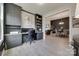 Well-organized home office with custom cabinetry and a view of the living space at 3029 Trace Meadow Ct, York, SC 29745