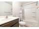 Cozy bathroom featuring a shower-tub combination, single sink vanity with a dark brown cabinet and neutral decor at 3033 Green Apple Dr, Dallas, NC 28034