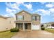 Charming two-story home with stone accents, a single-car garage, and a well-manicured front yard at 3033 Green Apple Dr, Dallas, NC 28034