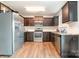 Well-equipped kitchen with stainless steel appliances and dark wood cabinets at 3033 Green Apple Dr, Dallas, NC 28034