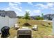 Inviting backyard featuring outdoor seating and a grill, perfect for entertaining or relaxing in the serene surroundings at 314 Embers Ln, Clover, SC 29710