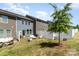 Fenced backyard with outdoor seating and grill, offering a private and relaxing space for gatherings and leisure at 314 Embers Ln, Clover, SC 29710