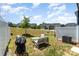 Serene backyard featuring a cozy seating area with a grill, ideal for outdoor gatherings and leisure at 314 Embers Ln, Clover, SC 29710