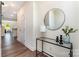 Hallway featuring hardwood floors, a front door with sidelights, stylish console table and view to an open concept living space at 314 Embers Ln, Clover, SC 29710