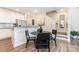 Eat-in kitchen with breakfast bar, white cabinets and stainless steel appliances at 314 Embers Ln, Clover, SC 29710