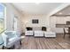 Bright living room featuring a comfortable sectional sofa and hardwood floors at 314 Embers Ln, Clover, SC 29710