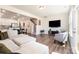 Open-concept living room with a staircase, TV, and modern decor at 314 Embers Ln, Clover, SC 29710