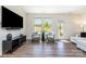 Bright living room with hardwood floors, stylish seating, and large windows offering natural light and outdoor views at 314 Embers Ln, Clover, SC 29710