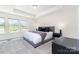 Well-lit main bedroom with trey ceilings, two windows, and stylish decor at 314 Embers Ln, Clover, SC 29710