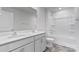 Bright bathroom featuring a double vanity, tub-shower combo, and tile flooring at 3535 Cramer Creek Dr, Gastonia, NC 28056