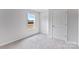 Bedroom with neutral carpet, a window with a view, and closet door at 3535 Cramer Creek Dr, Gastonia, NC 28056