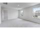 Bright bedroom featuring two windows and a doorway with ample sunlight at 3535 Cramer Creek Dr, Gastonia, NC 28056