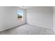 Well-lit bedroom with neutral carpet and a window overlooking construction site at 3535 Cramer Creek Dr, Gastonia, NC 28056