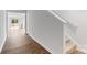 Inviting entryway with wood floors, staircase, and view into the living area at 3535 Cramer Creek Dr, Gastonia, NC 28056