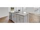 Kitchen island with stainless dishwasher, sink, and ample cabinet storage at 3535 Cramer Creek Dr, Gastonia, NC 28056