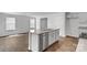 Kitchen island features a stainless steel dishwasher and double sink at 3535 Cramer Creek Dr, Gastonia, NC 28056