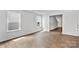 Bright living room with wood floors, windows, and neutral paint at 3535 Cramer Creek Dr, Gastonia, NC 28056