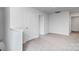 Upstairs loft area featuring neutral carpet, white walls, and access to doorways at 3535 Cramer Creek Dr, Gastonia, NC 28056